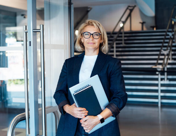 Female company director in lobby of building