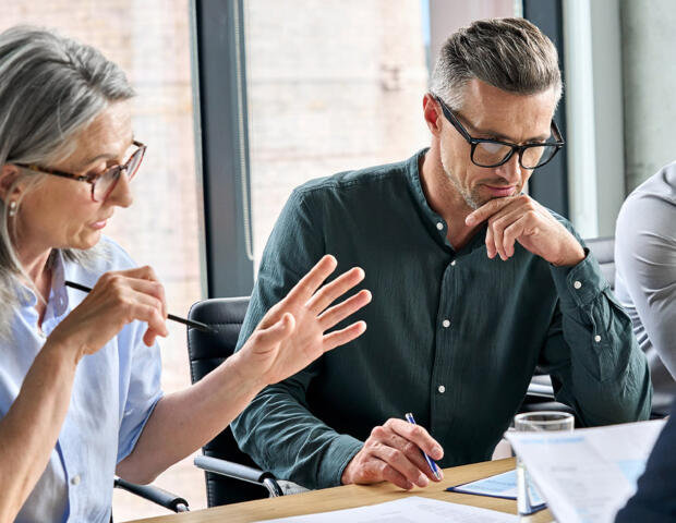 Two business people discussing accounting services in Ascot Vale office