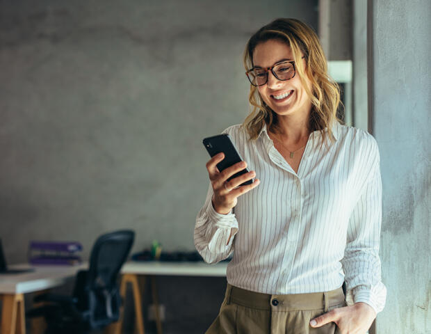 Woman wearing striped shirt on phone discussing finance services in Ascot Vale, Melbourne